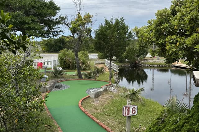 Hole 6 mini golf fairway beside the pond at Frisco Mini Golf Outer Banks